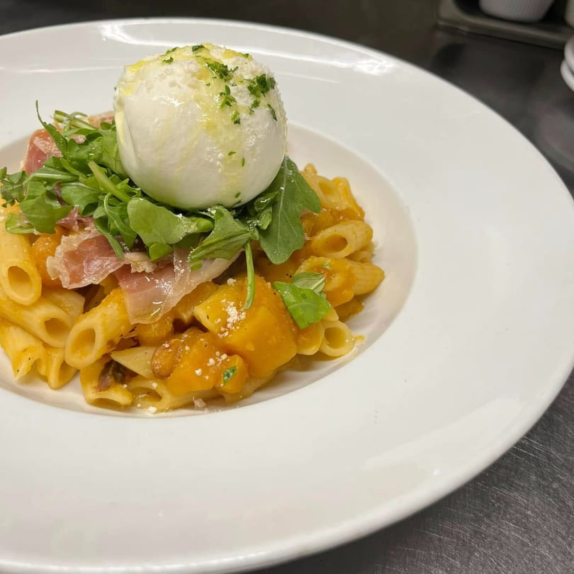 Favio's Trattoria's penne pasta with butternut squash, prosciutto, arugula, and burrata cheese.