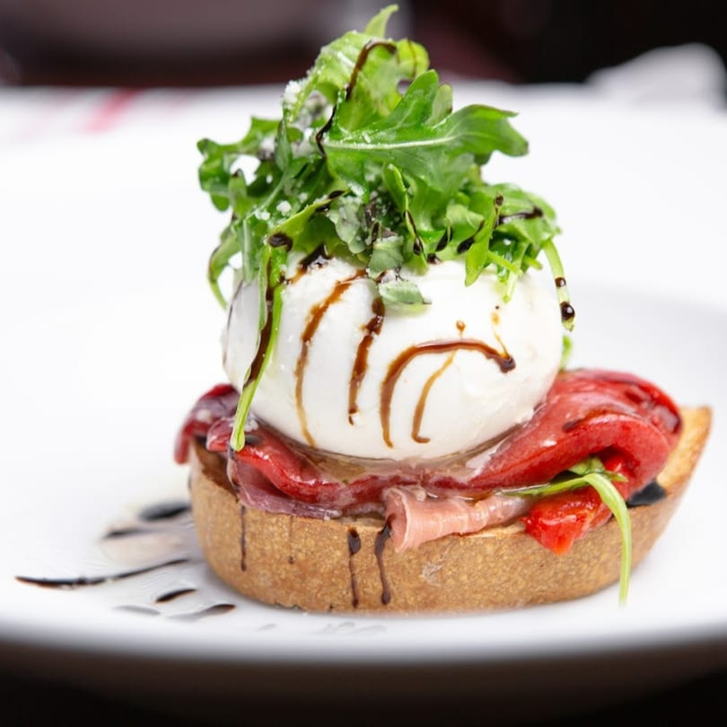 Favio's Trattoria's bruschetta with burrata, prosciutto, roasted red peppers, arugula, and balsamic glaze.