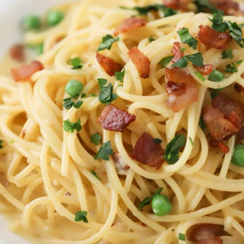 Favio's Trattoria's spaghetti carbonara with crispy bacon, green peas, and fresh parsley.