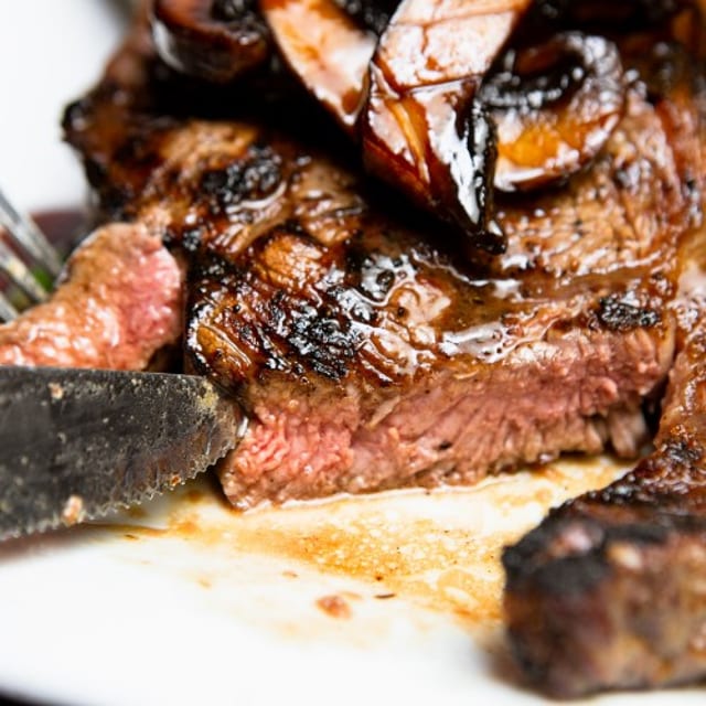 GRILLED RIB EYE STEAK.